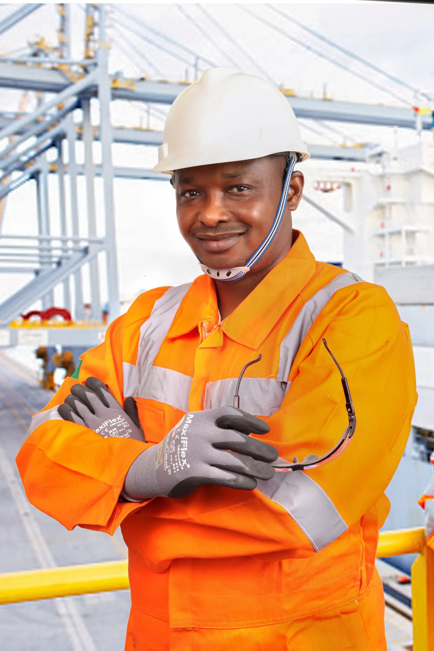Operator in safety gear on a port quay